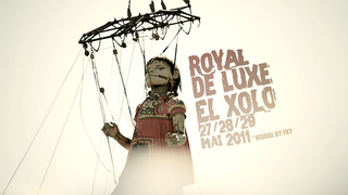 This is what an 18-foot-tall, 1700-pound marionette walking down the street looks like